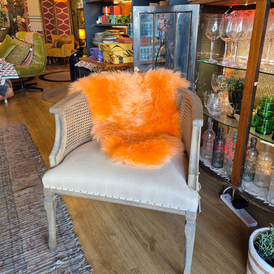 The softest sheepskin which has been dyed a mellow orange colour