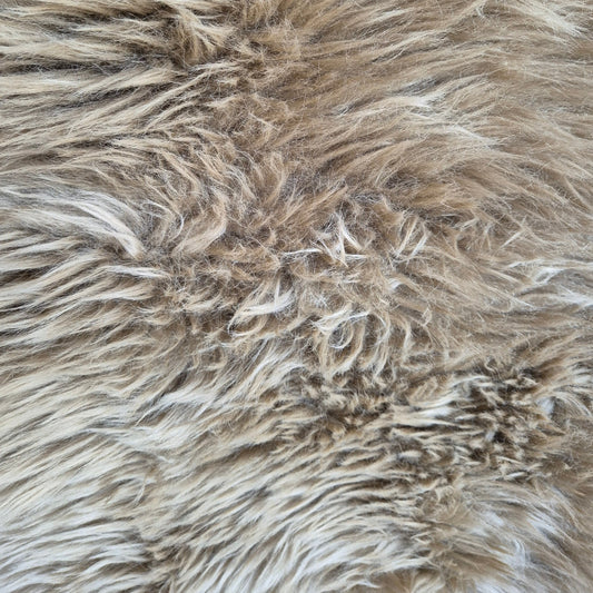 A close up of the taupe sheepskin