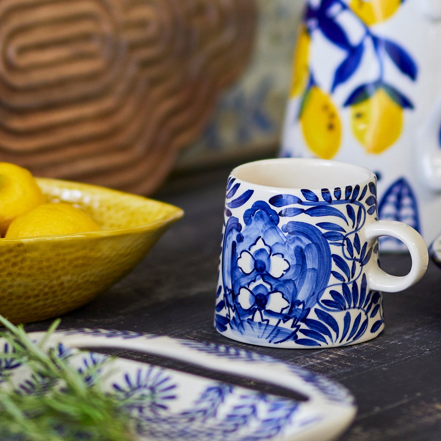 The blue and white stoneware hand painted mug is inspired by the aesthetic of the Mediteranian