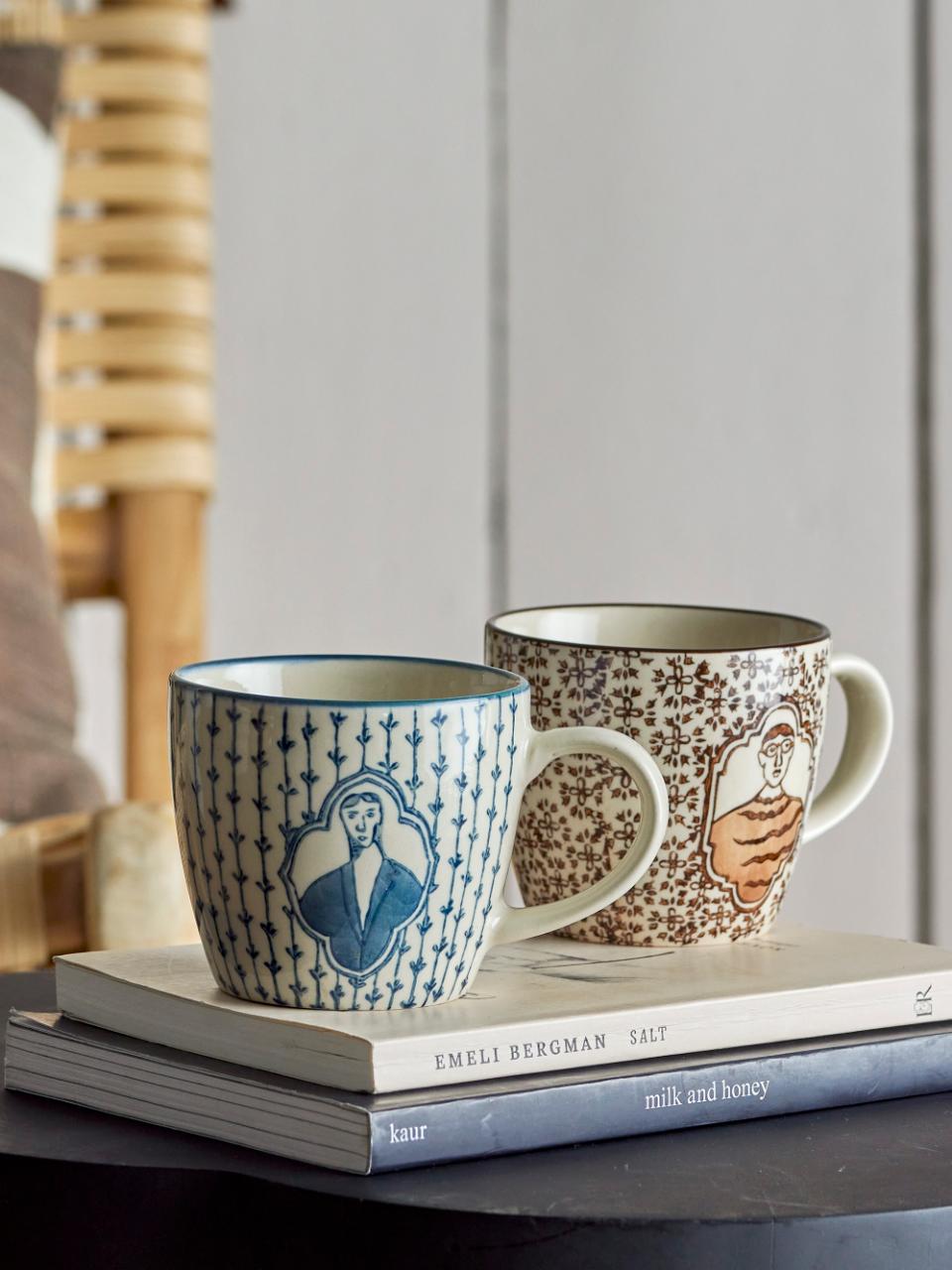 Tom Mug with picture of boy in frame and repeated brown flower motifs