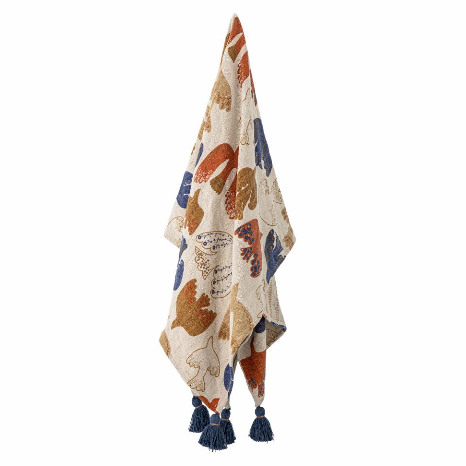 throw with bird motifs and blue tassels