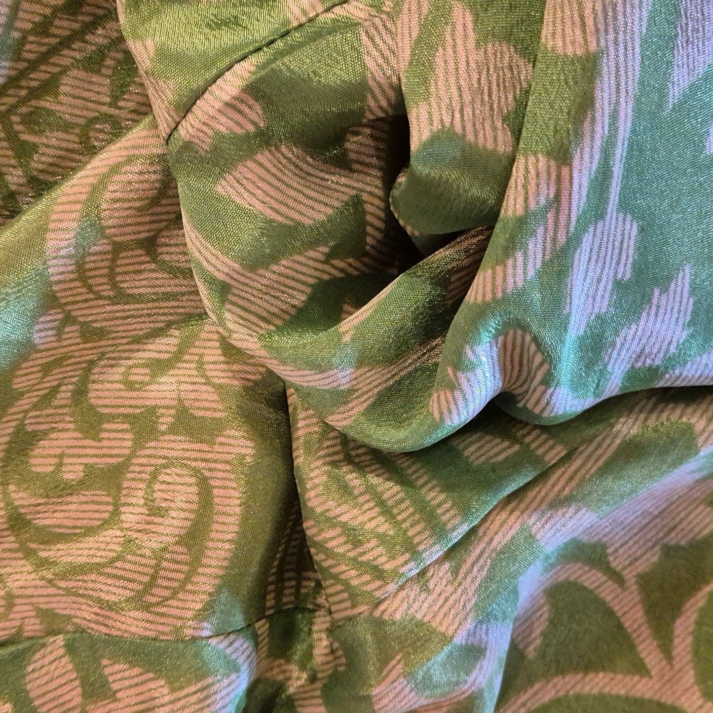 A reversible silk kimono made with vintage up-cycled silk sari fabric. Each side is completely different and each kimono is completely unique