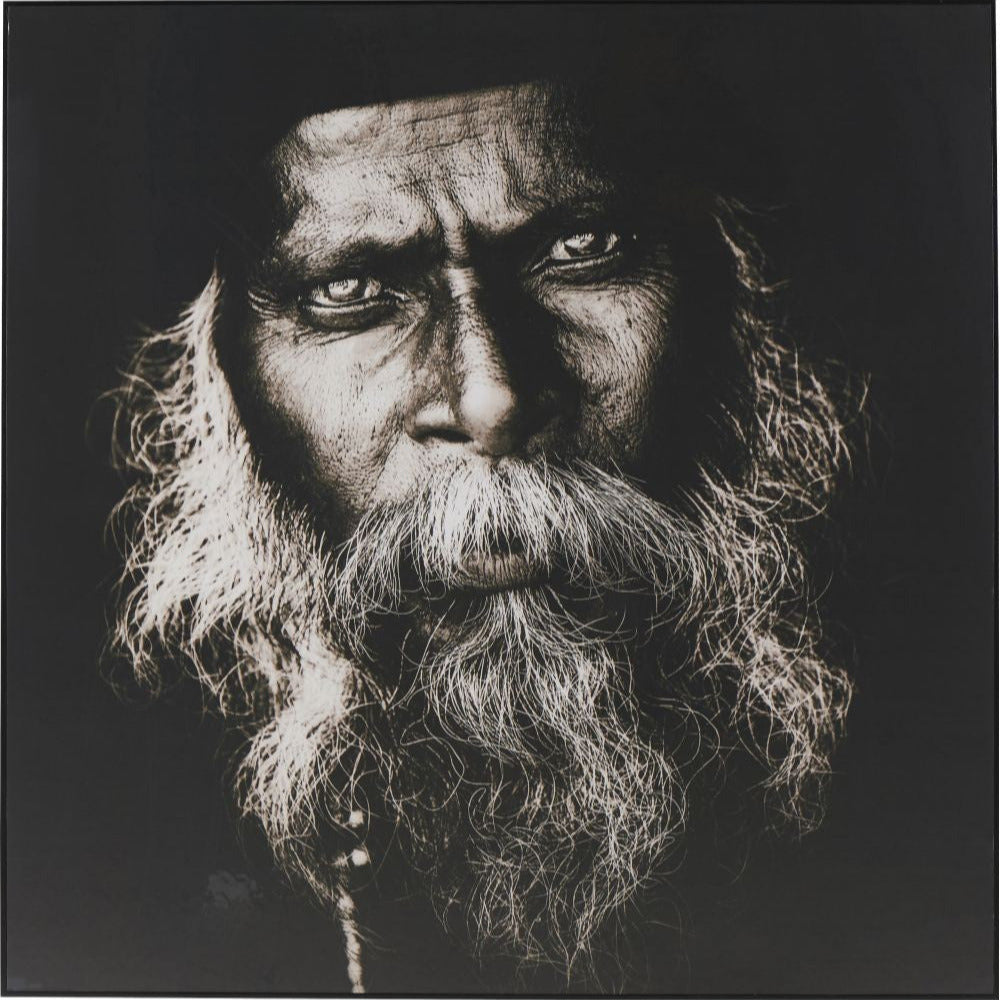 Black and white portrait of a hindu man on black background