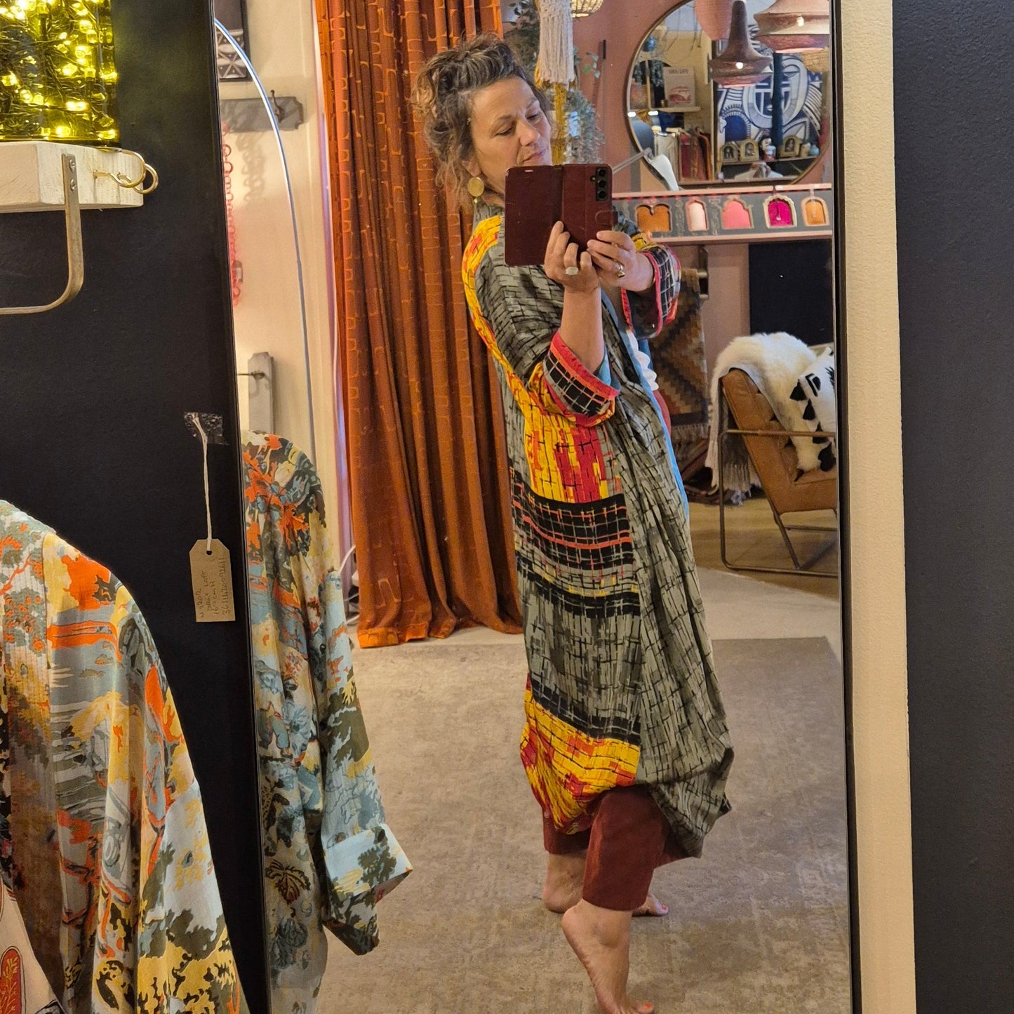 A reversible silk kimono made with vintage up-cycled silk sari fabric. Each side is completely different and each kimono is completely unique