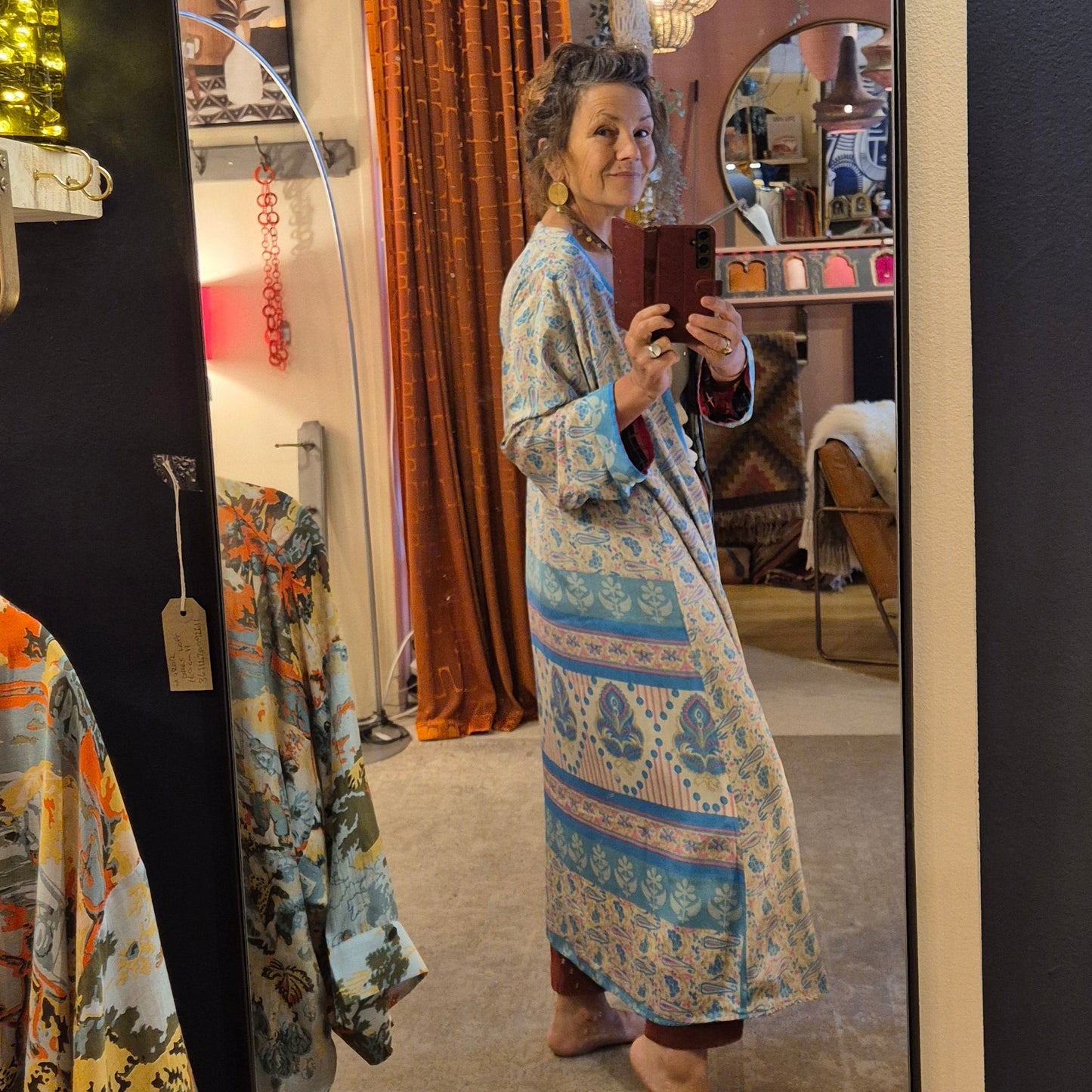 A reversible silk kimono made with vintage up-cycled silk sari fabric. Each side is completely different and each kimono is completely unique