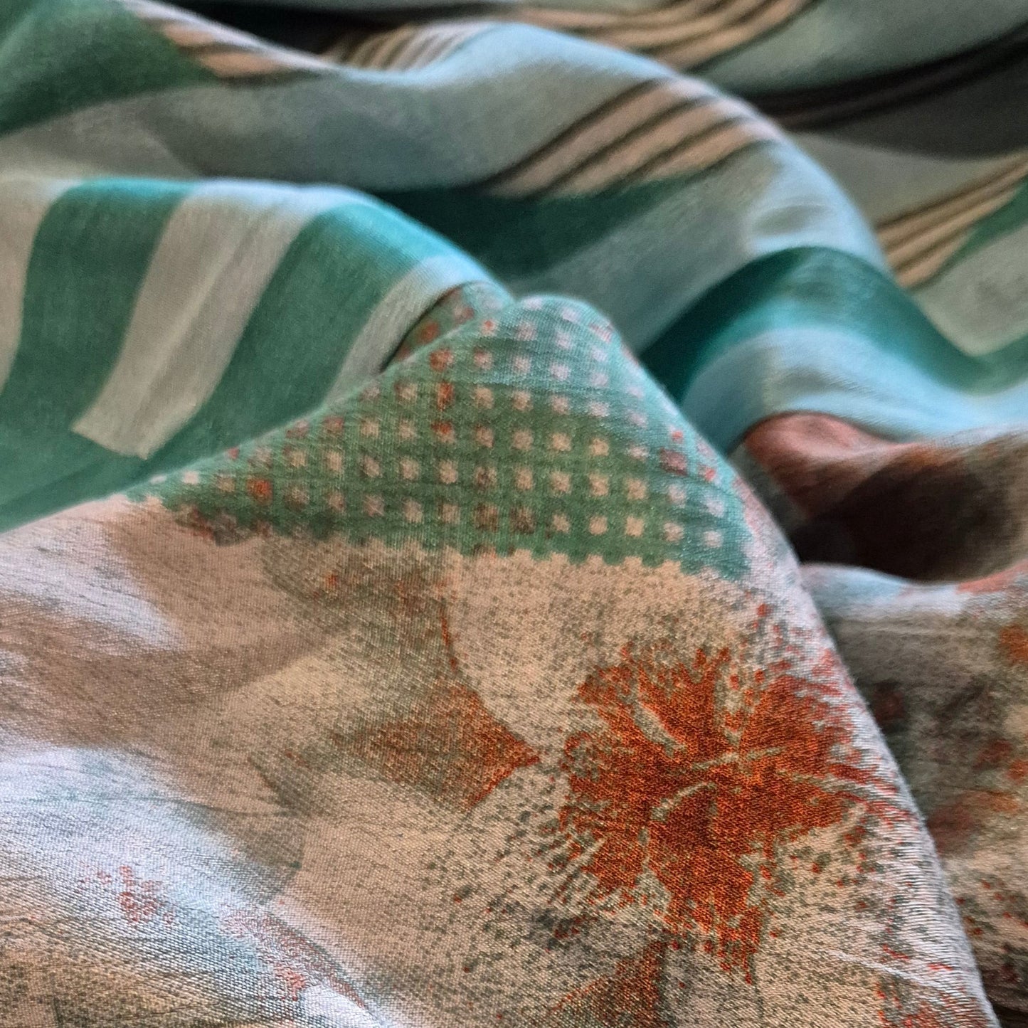 A reversible silk kimono made with vintage up-cycled silk sari fabric. Each side is completely different and each kimono is completely unique