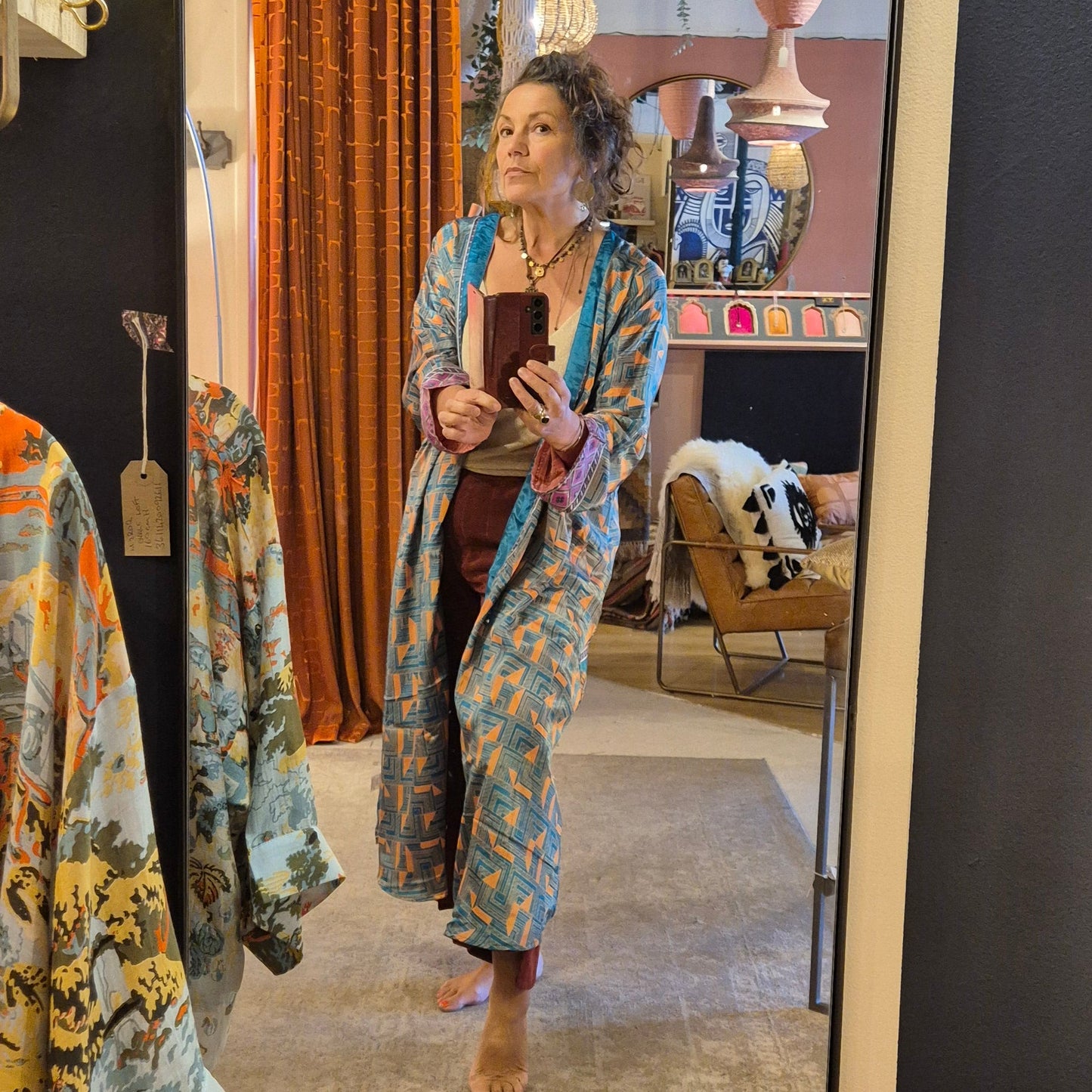 A reversible silk kimono made with vintage up-cycled silk sari fabric. Each side is completely different and each kimono is completely unique
