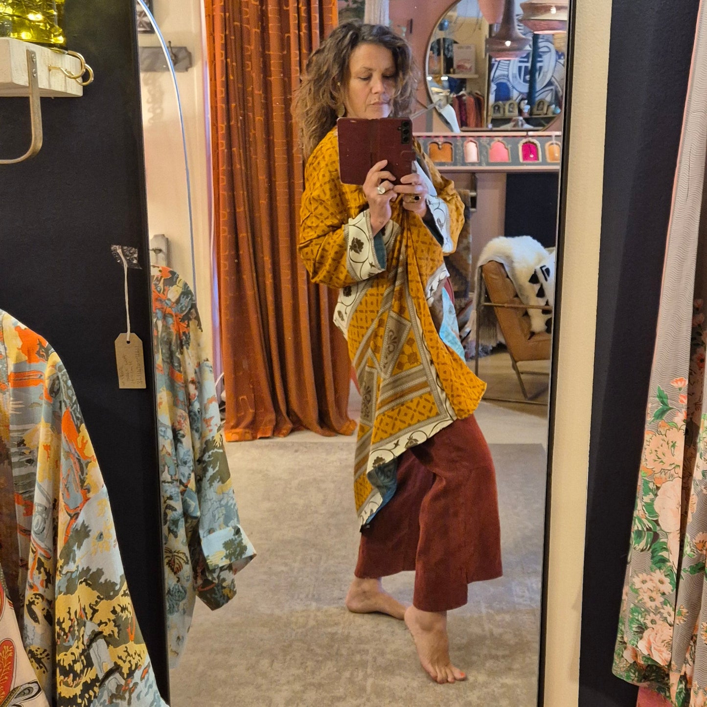 A reversible silk kimono made with vintage up-cycled silk sari fabric. Each side is completely different and each kimono is completely unique
