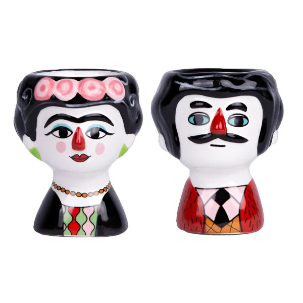 egg cups with figures of carlos and marisol in colour