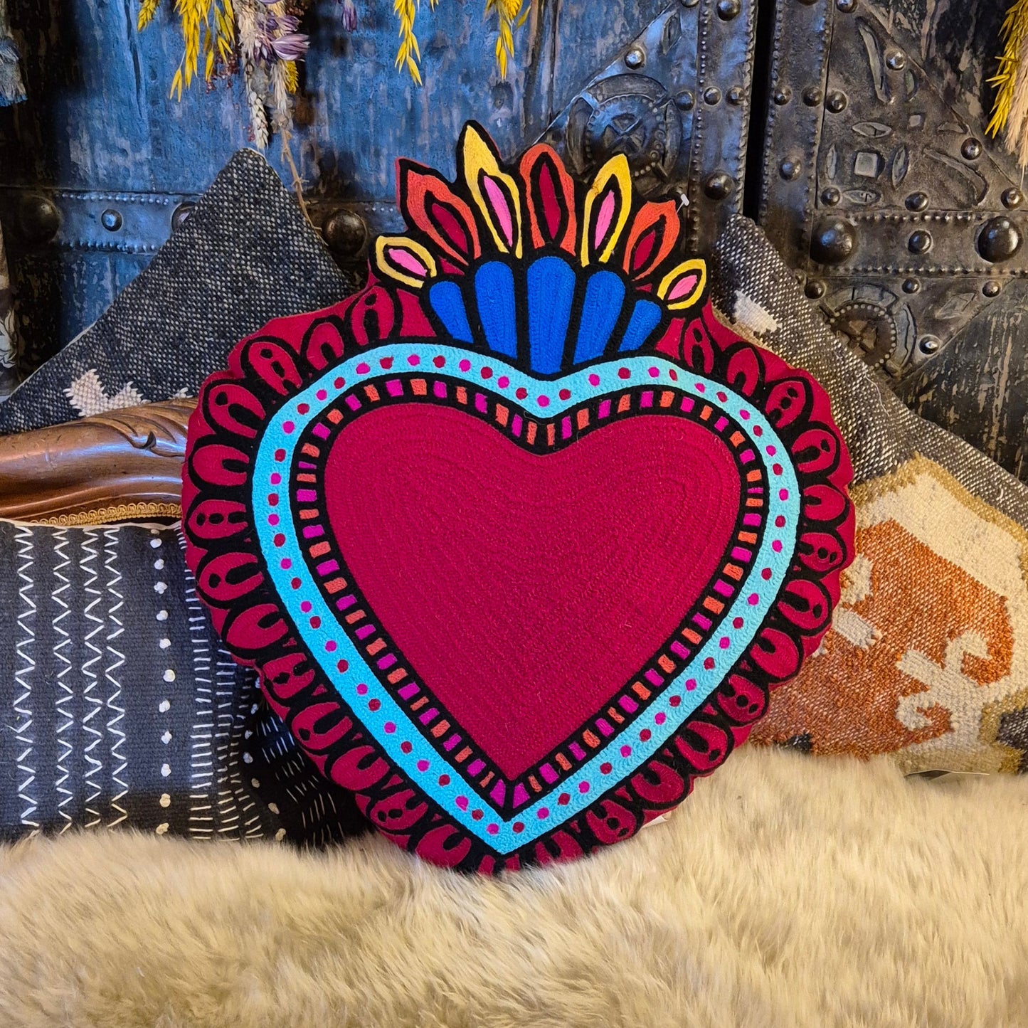 Back in stock. A statement cushion. The ever popular Milagro Heart Cushion in pink, is also available in red. Milagro means small miracle in Spanish and the Milagro Heart represents love healing and gratitude.