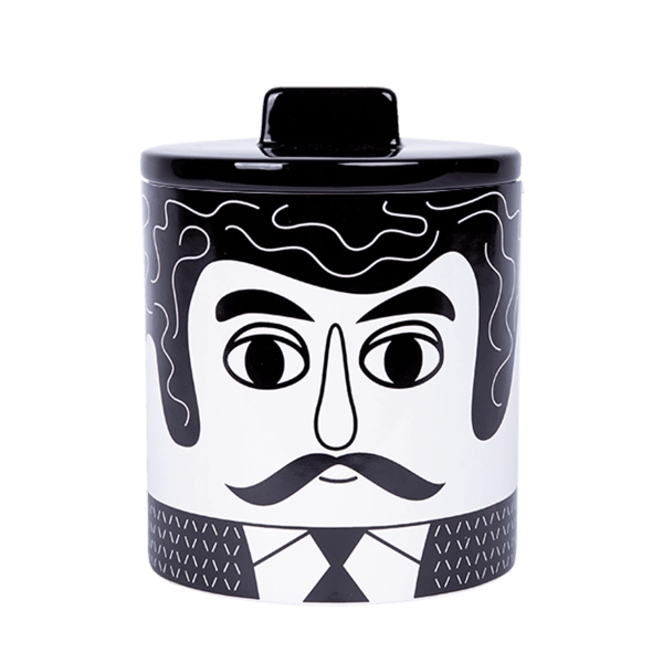 Black and white storage jar with the face of the Mexican man Carlos.