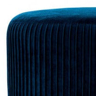 foot stool in blue velvet on four legs