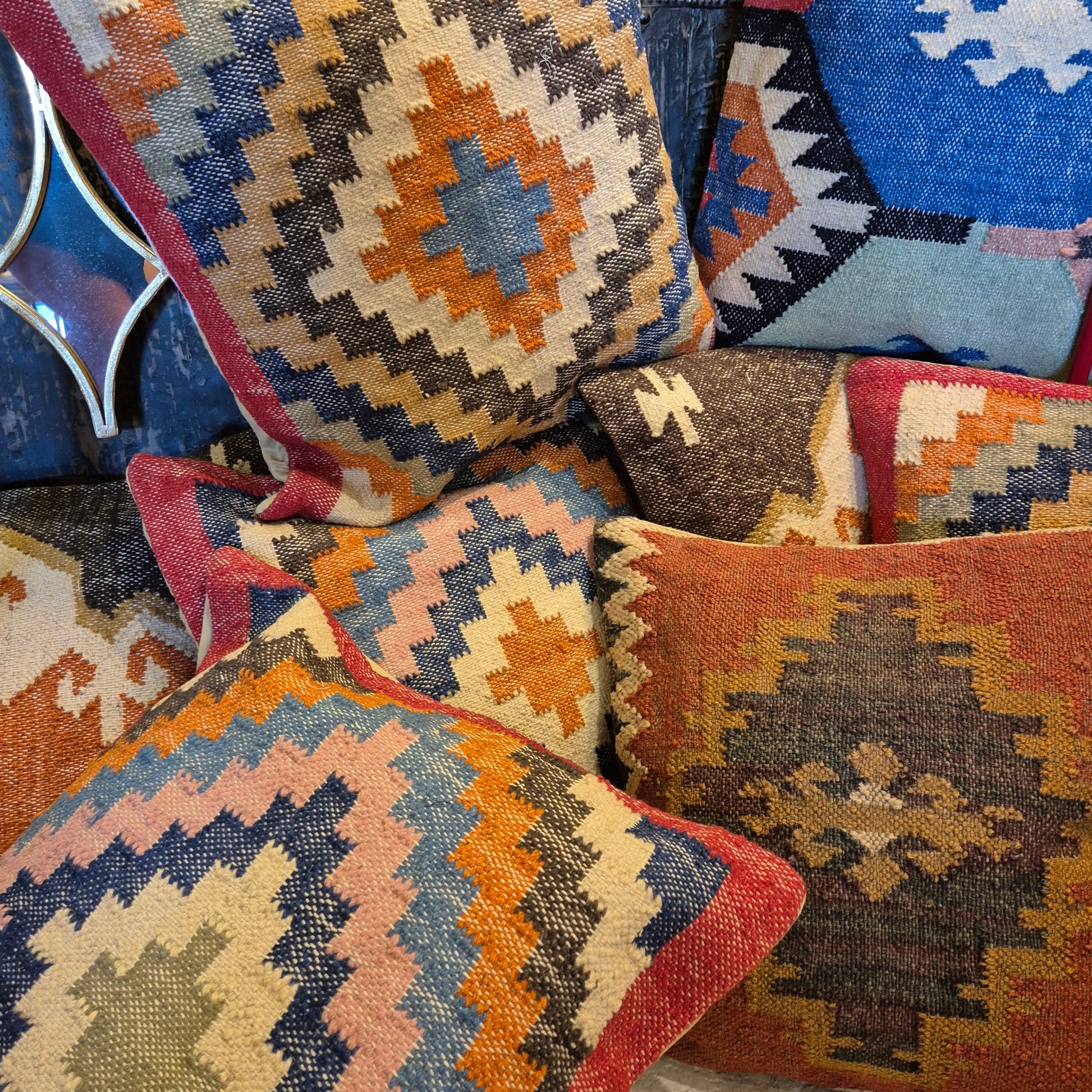 This kilim cushion is made from wool and jute and has a colourful classic geometric pattern coming from the center. Get an instant boho feel with this earthy textile.&nbsp;    55cm x 55cm  Wool and jute