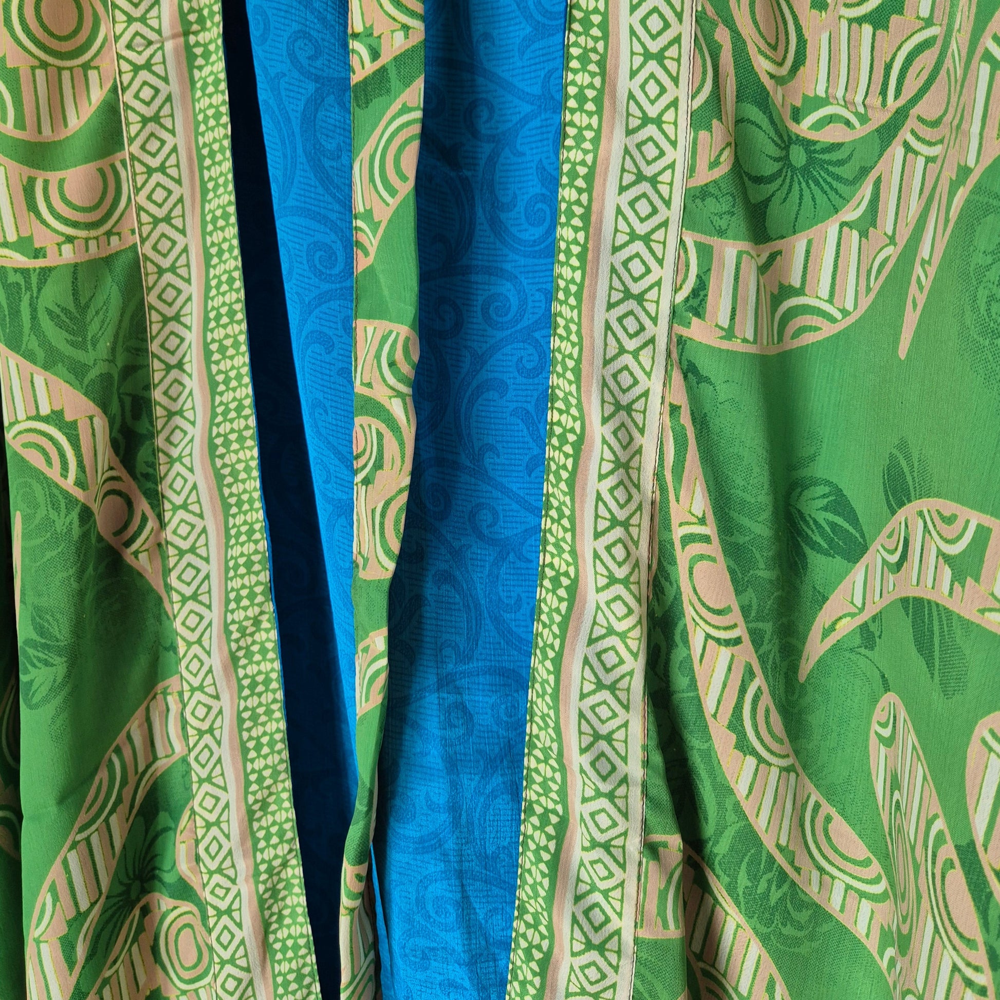 Introducing our Silk Kimono Reversible 19 - the perfect blend of unique style and sustainability. Made from 100% upcycled saris, this long kimono is perfect for both day and evening wear. With its reversible design, you can switch up your look in an instant.&nbsp;