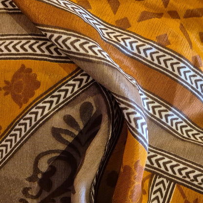 A reversible silk kimono made with vintage up-cycled silk sari fabric. Each side  is completely different and each kimono is completely unique