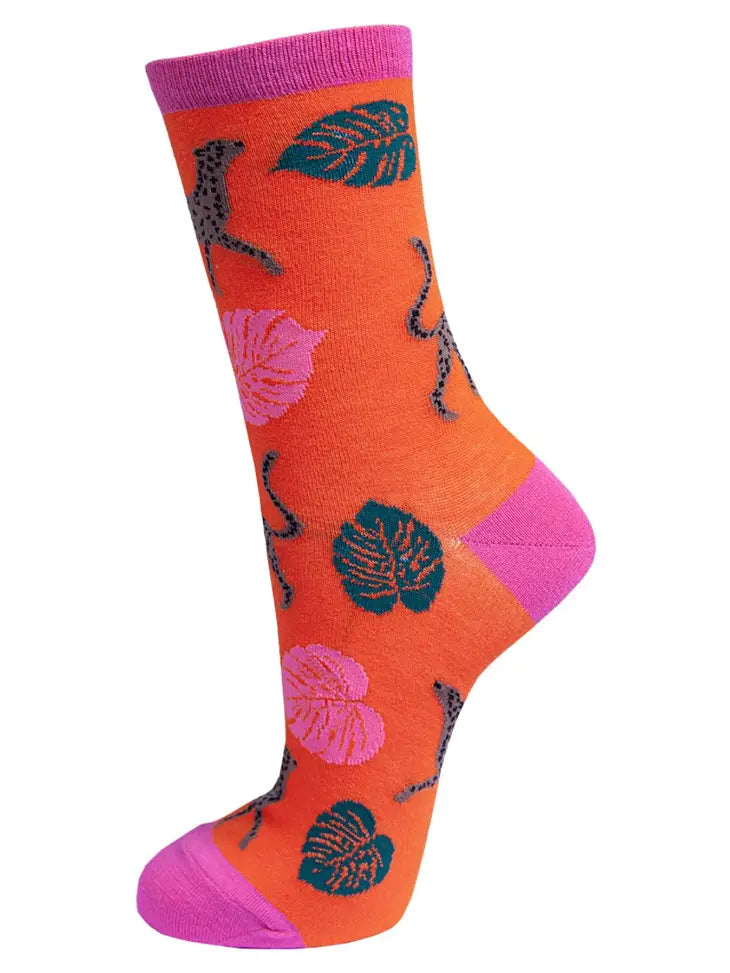 Brightly coloured orange and pink backgound bamboo breathable socks with leopard print cheetah and leaves size 3-7