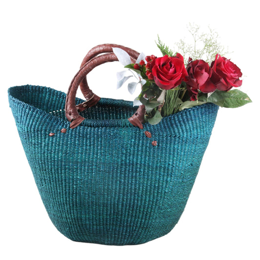 An oval basket with bold colors combined with sophisticated design – Each basket is unique and lovingly handcrafted.

