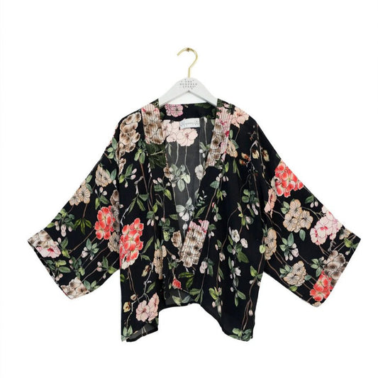 Floral kimono-style jacket trailing flowers red and white on black background
