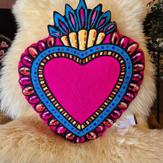 Back in stock. A statement cushion. The ever popular Milagro Heart Cushion in pink, is also available in red. Milagro means small miracle in Spanish and the Milagro Heart represents love healing and gratitude