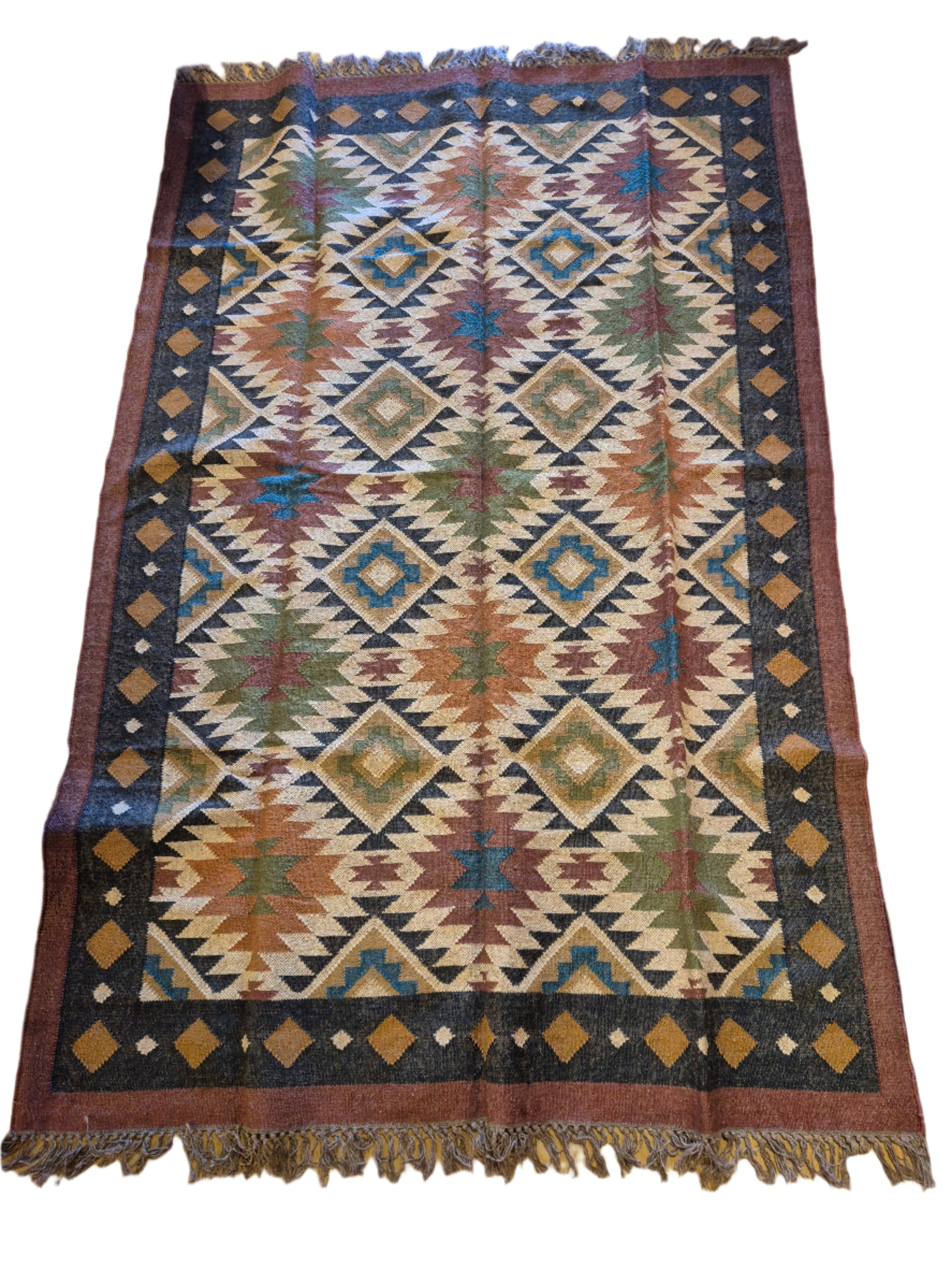 MULTICOLOURED  KILIM RUG  WITH TRADITIONAL PATTERNS AND FRINGES ON EACH END. WOOL AND JUTE 6X9