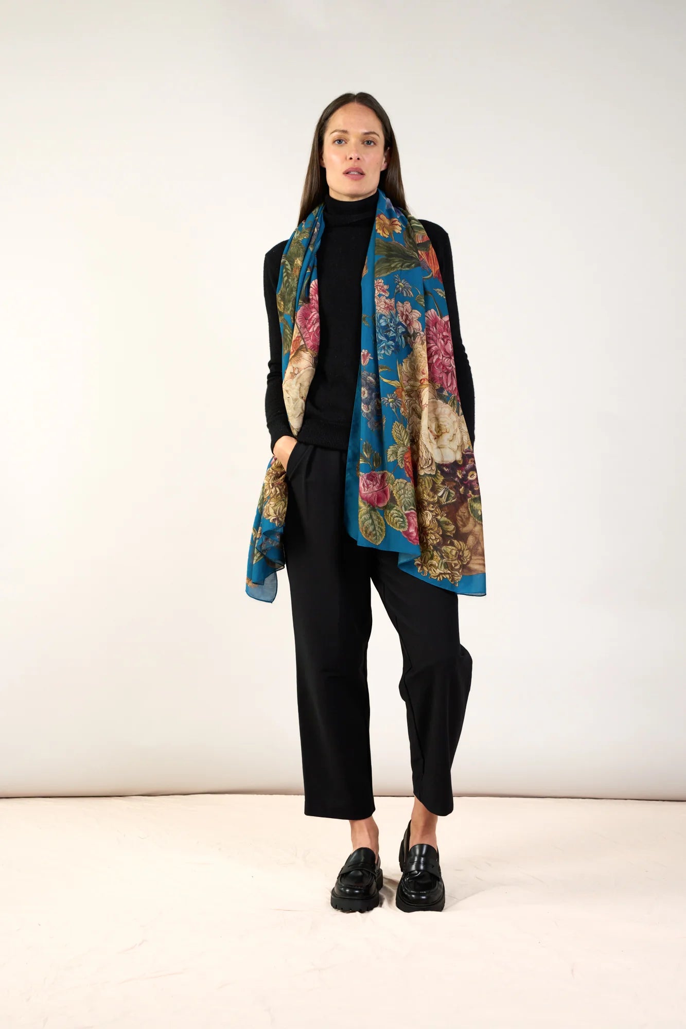 teal scarf with a botanical print