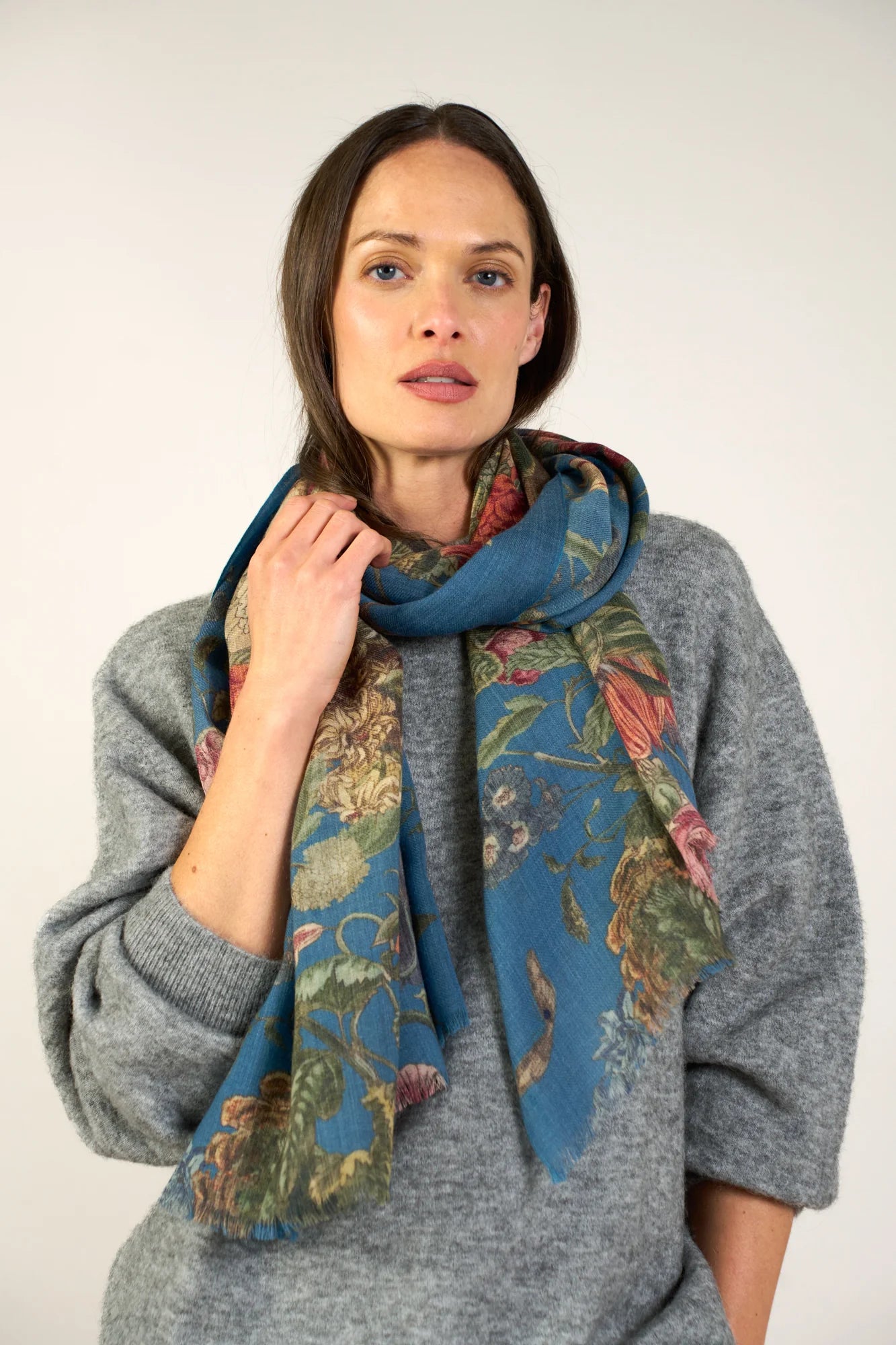 wool scarf with botanical print on teal background