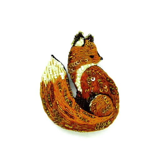 A beautiful red fox brooch made from sequence, beads,, cotton and wire. It is handmade and comes in a blue gift box.