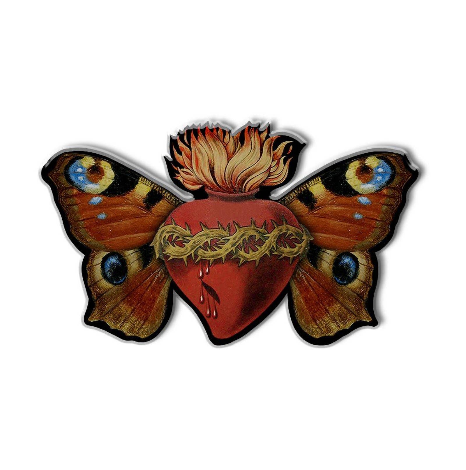 Pin with butterfly design with flaming heart at centre.
