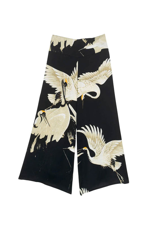 palazzo pants with stork design and black background