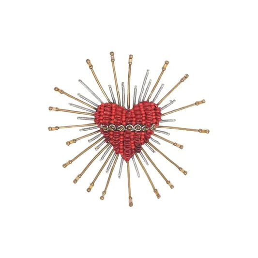 A red heart in the style of a sacred heart with light spiking out around it in the form of wire with beads. Hand made