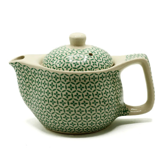 small teapot with strainer.  Has green mosaic design.