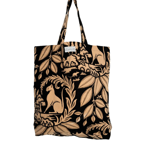 black tote bag with terracotta coloured design of sphinx and botanical - one hundred stars