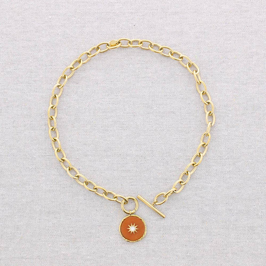 link necklace with orange stone pendant with star inset