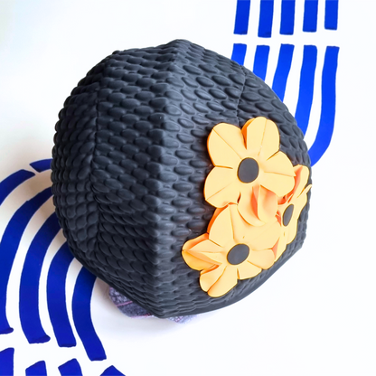 Black retro swim hat with three orange flowers on the side