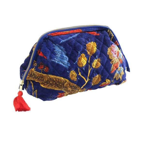 A beautiful velvet cosmetic bag with an oriental print on a royal blue background