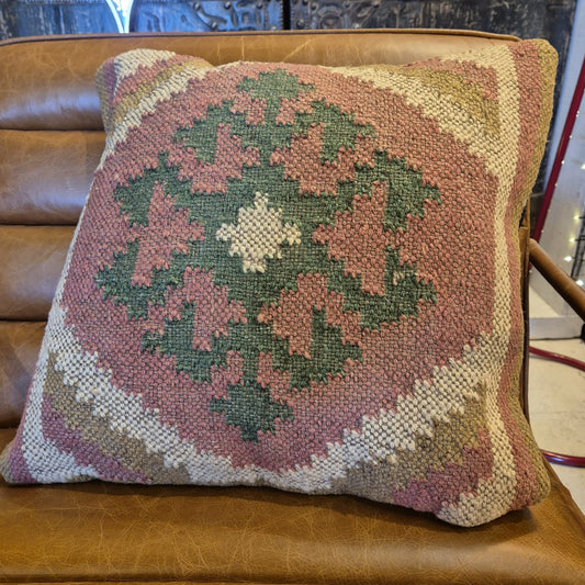This kilim cushion is made from wool and has a colourful classic geometric pattern coming from the center. Get an instant boho feel with this earthy textile accent cushion.