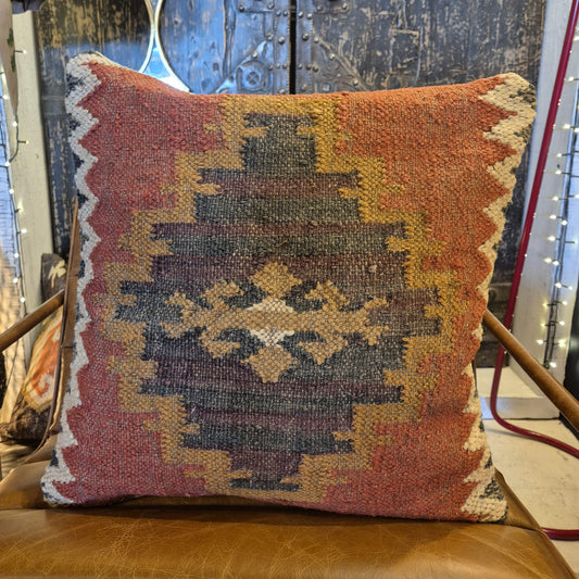 This kilim cushion is made from wool and has a colourful classic geometric pattern coming from the center. Get an instant boho feel with this earthy textile accent cushion