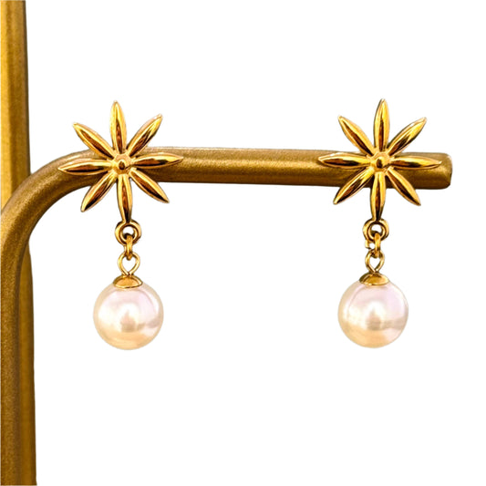 pendant pearl earrings with flower designed. stud