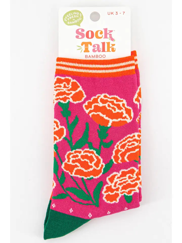 Bamboo ladies socks with a pink background and a floral design