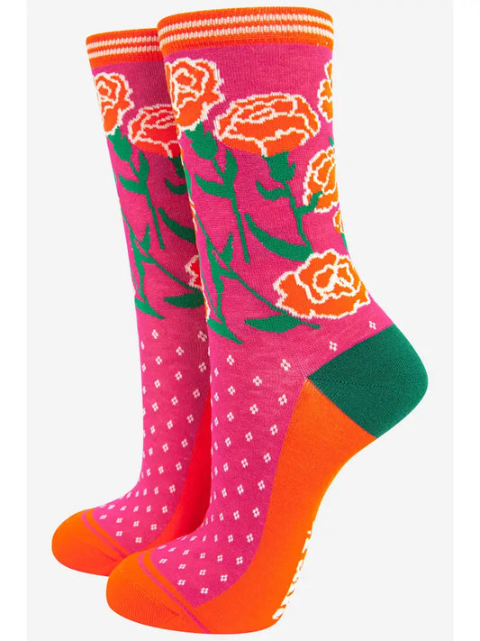 Bamboo ladies socks with a pink background and a floral design