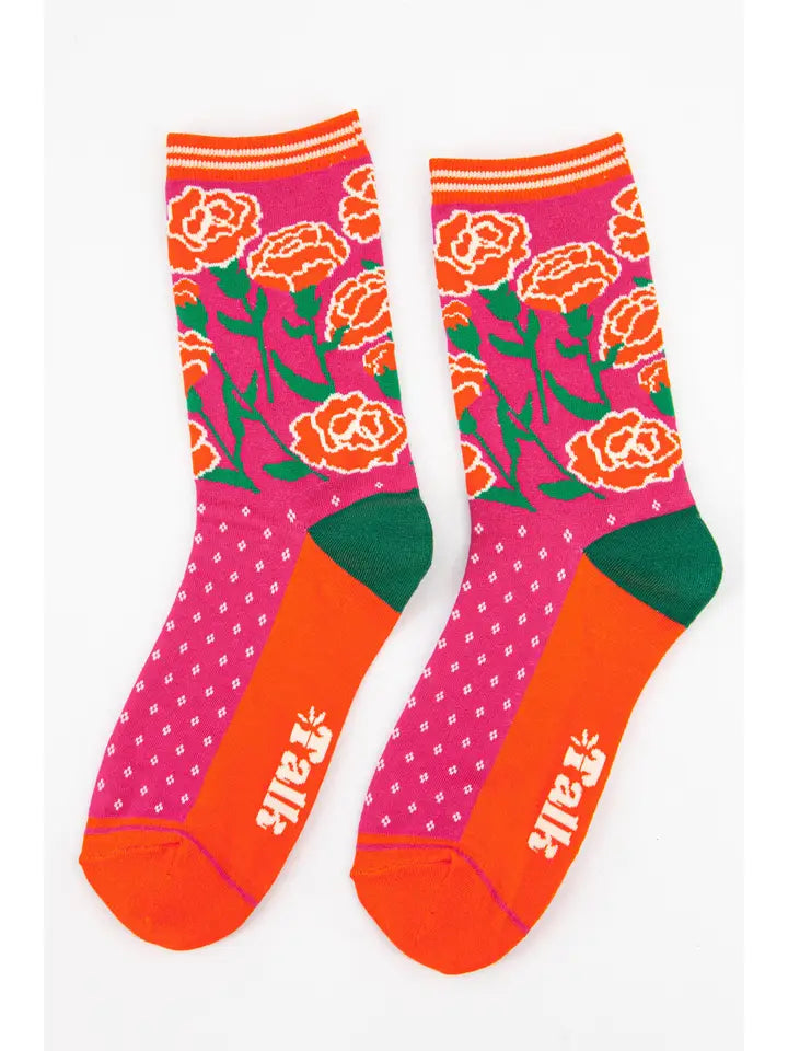 Bamboo ladies socks with a pink background and a floral design