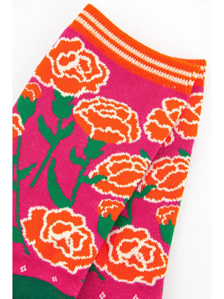 Bamboo ladies socks with a pink background and a floral design