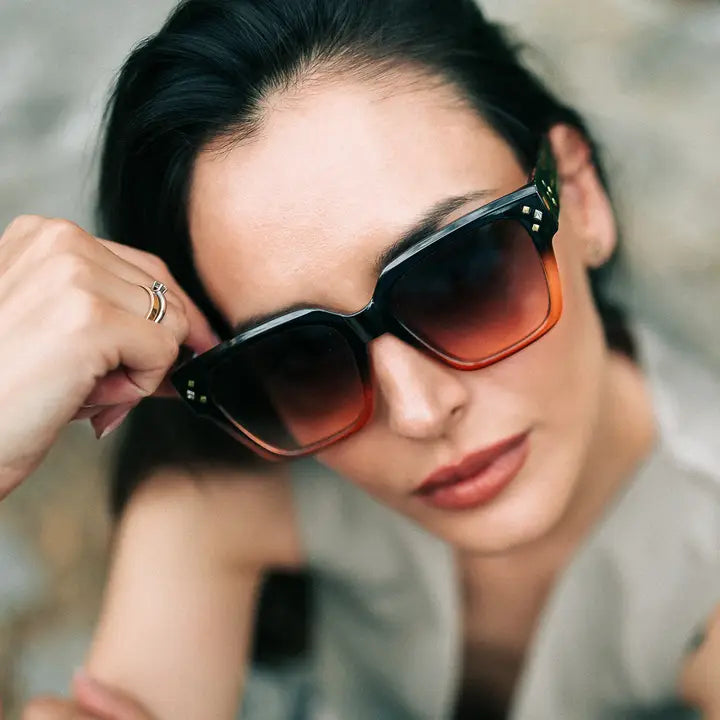 sunglasses with black and sunburst colour frame. 