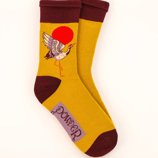 Bamboo mix socks for men, mustard yellow with a crane at sunrise on them