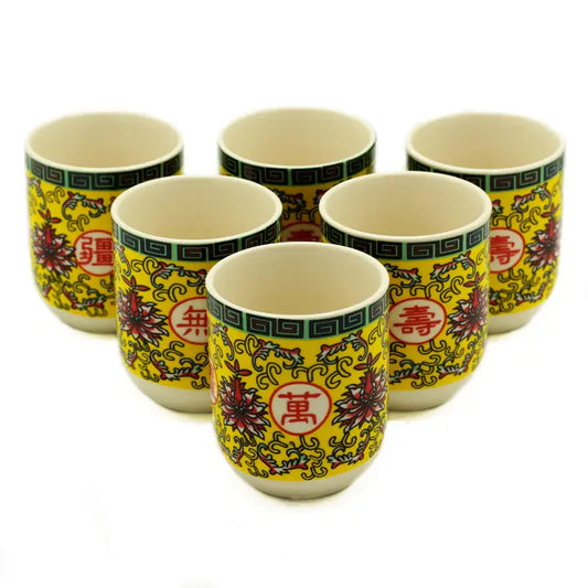 Small handleless tea cups with a blue background and daisy design.

Ceramic

Weight: 90.7g