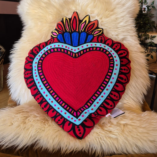 Back in stock. A statement cushion. The ever popular Milagro Heart Cushion in pink, is also available in red. Milagro means small miracle in Spanish and the Milagro Heart represents love healing and gratitude.