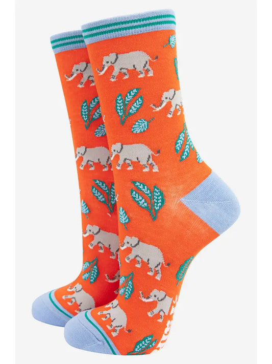 Bamboo ladies socks. An orange background with an elephants and leaf design