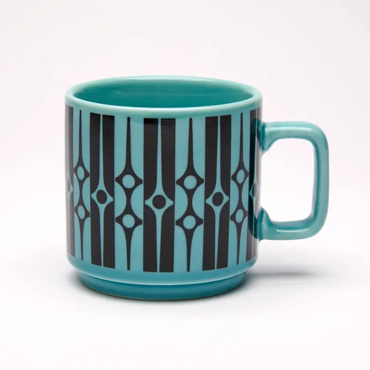 A reproduction of a 1967 designed mug by Hornsea Pottery. Teal with black design