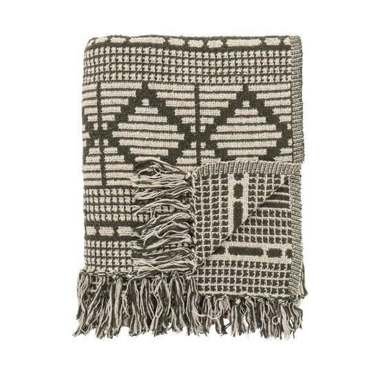 A soft and luxurious throw in gray/green with a decorative pattern and fringe