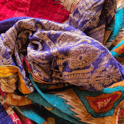 A colourful throw, made from up-cycled vintage Indian fabrics. Completely unique, no two are ever the same.
Front and back are also different giving the opportunity for a different look in different seasons
The throw features the distinctive kantha stitch.
A sustainable heirloom piece for gifting or self gifting.
220cm x 135cm approx